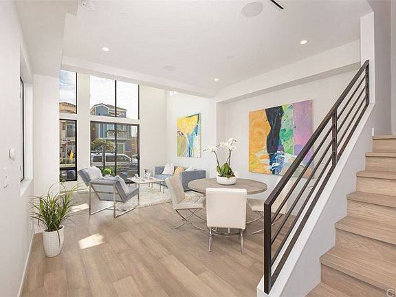 3-story house with roof deck, living and dining with stair