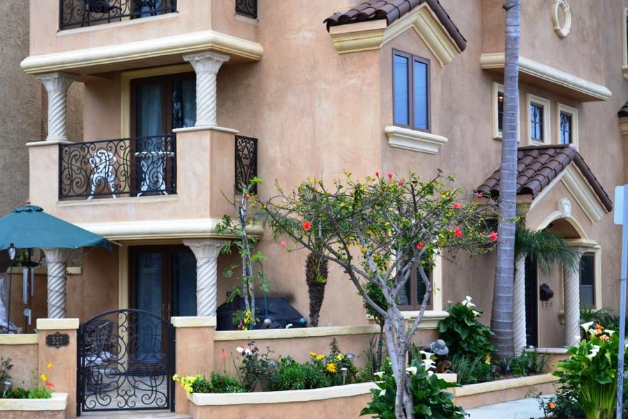 Existing three-story house, balconies and entry detail